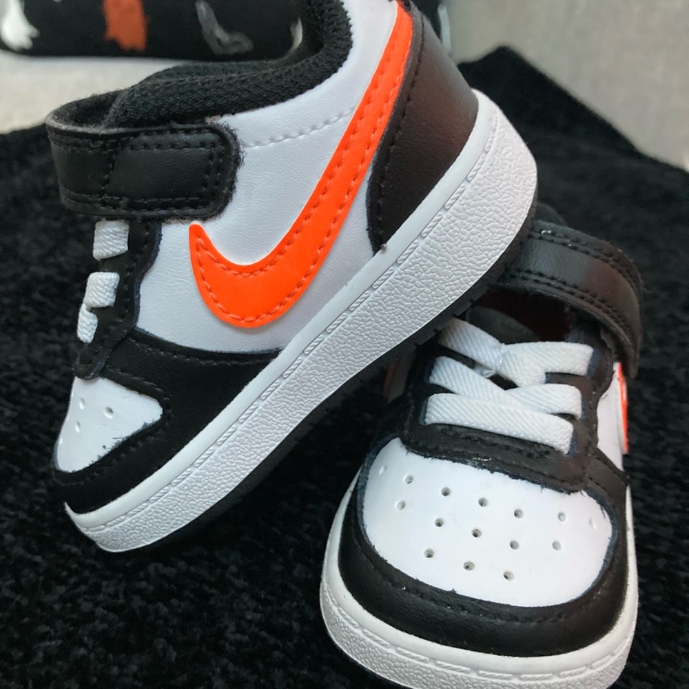 Nike baby shoes. This color combo perfect for fall and Halloween